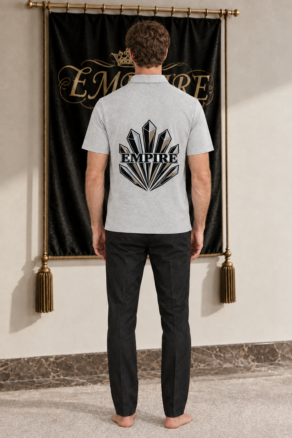 Light grey men's EMPIRE Obsidian Prism half-zip cotton polo shirt with black, white and beige crystal fan graphic positioned on the mid-back, rear view