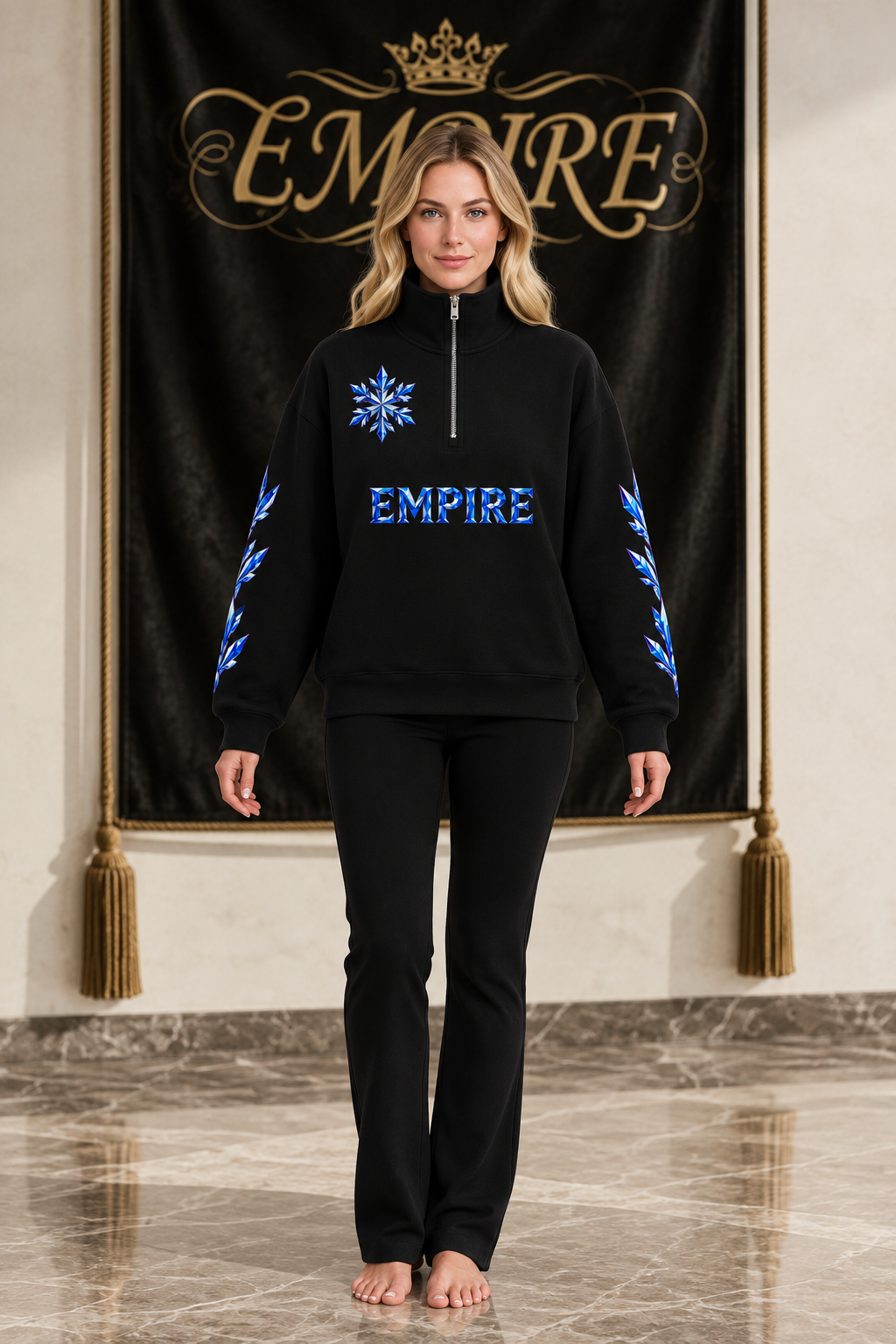 Sweatshirt femme EMPIRE Givre noir à quart de zip, flocon et lettrage saphir et argent devant, branches cristallines aux manches, vue de face sur mannequin