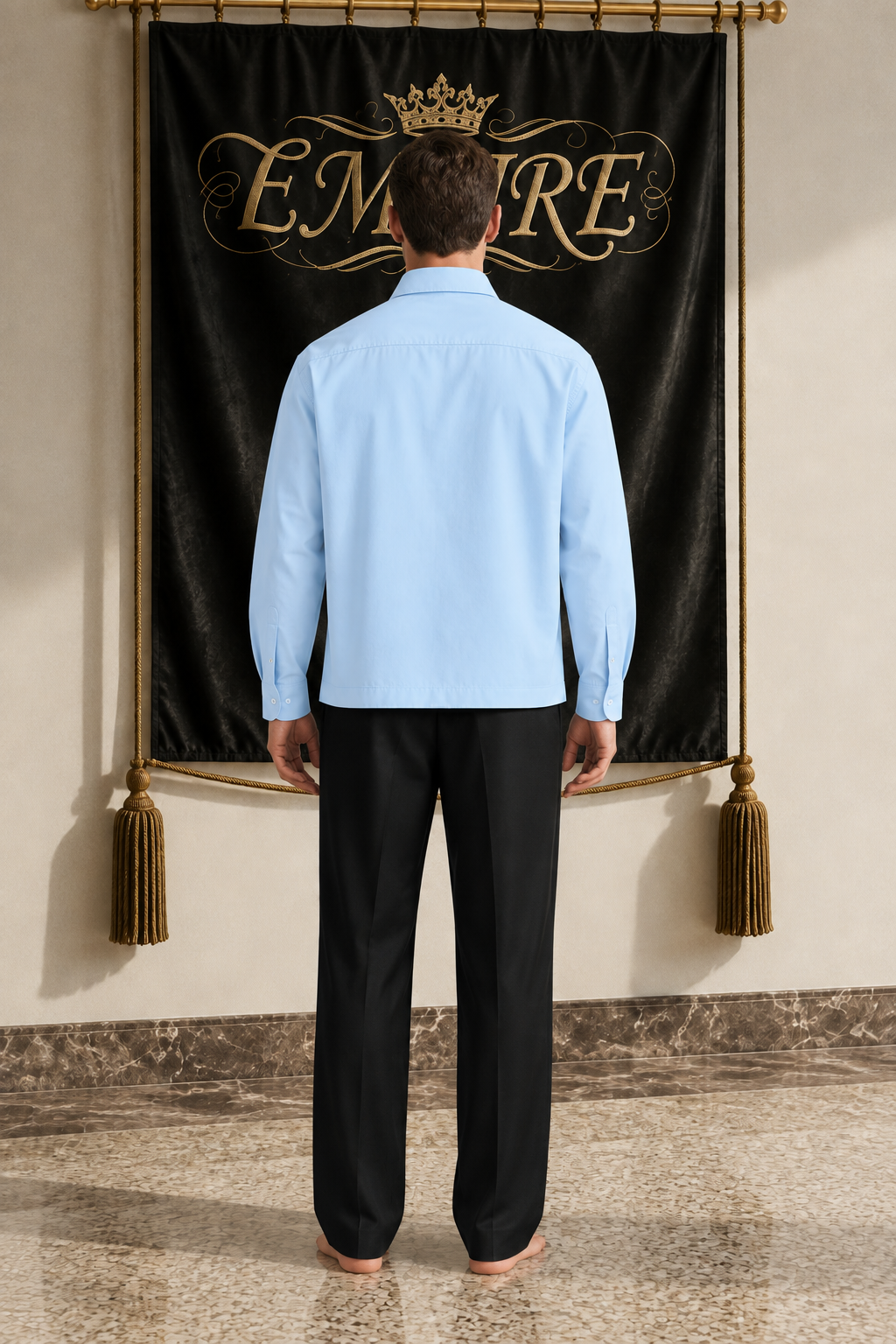Light blue men's EMPIRE boxy long-sleeve shirt with plain back, rear view on barefoot male model