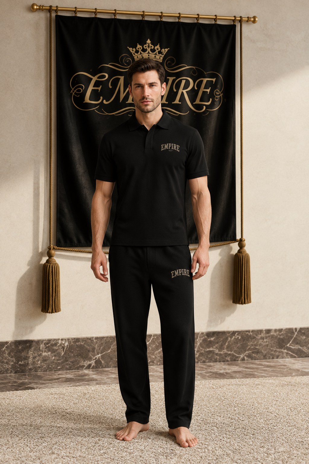 Black men's EMPIRE regular-fit polo shirt with arched chest wordmark, front view on barefoot male model