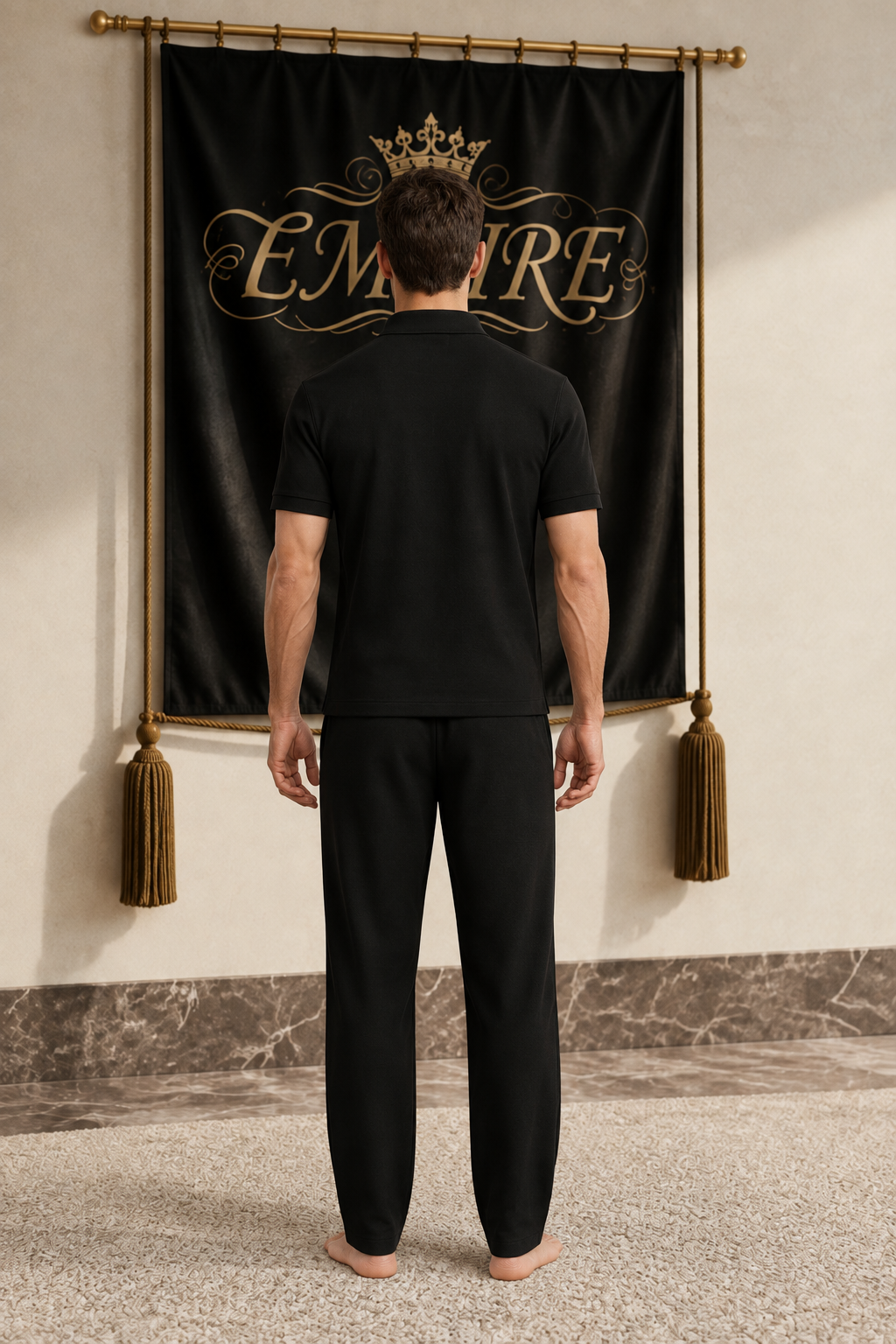 Black men's EMPIRE regular-fit polo shirt with plain back, rear view on barefoot male model
