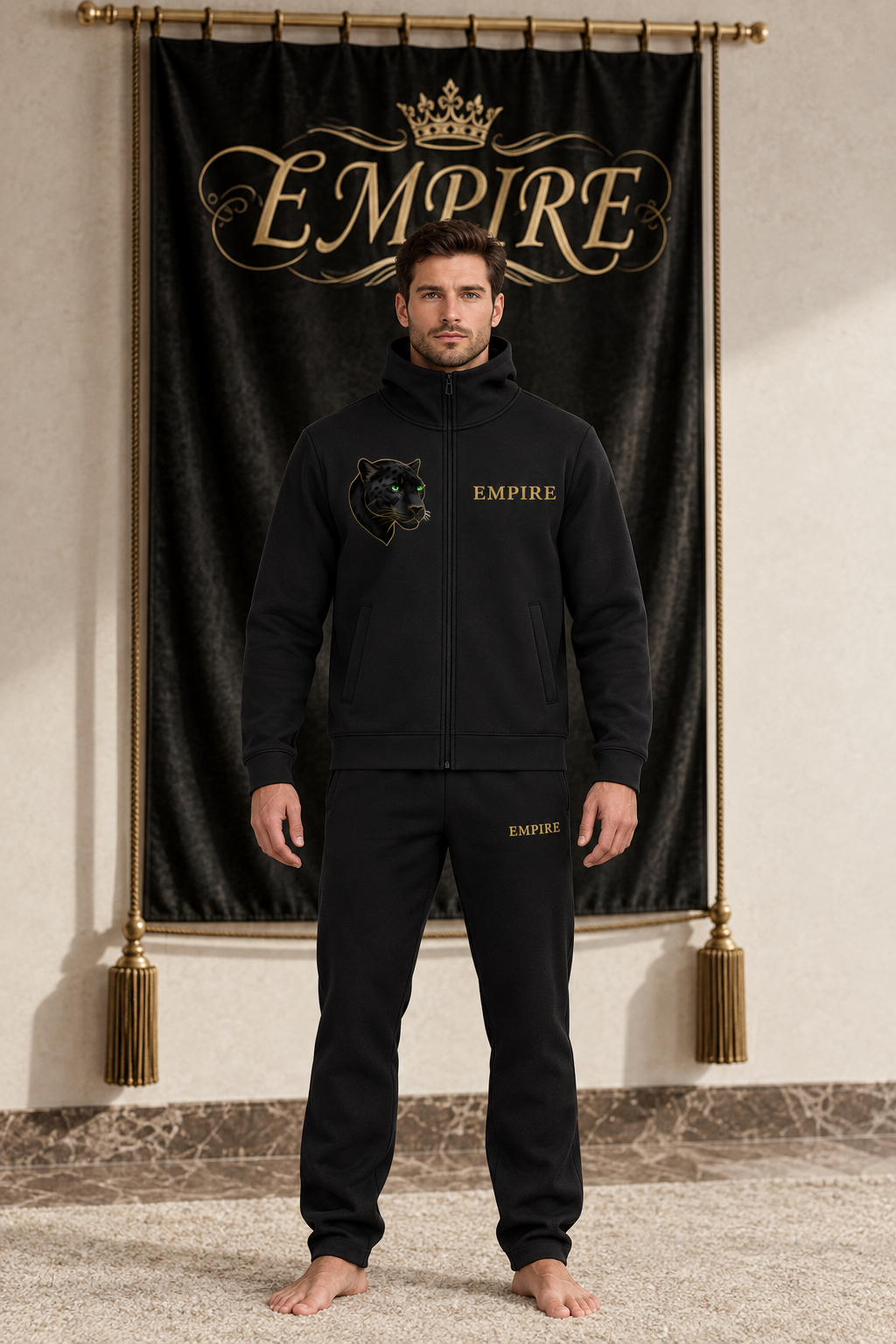 Black men's EMPIRE high-neck zip-up hoodie with emerald-eyed black panther chest graphic, front view on barefoot male model