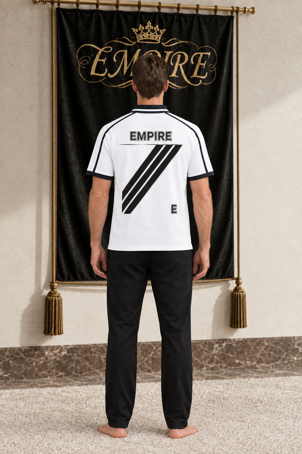 White men's EMPIRE contrast-piping raglan polo with diagonal black back stripes, rear view on barefoot male model