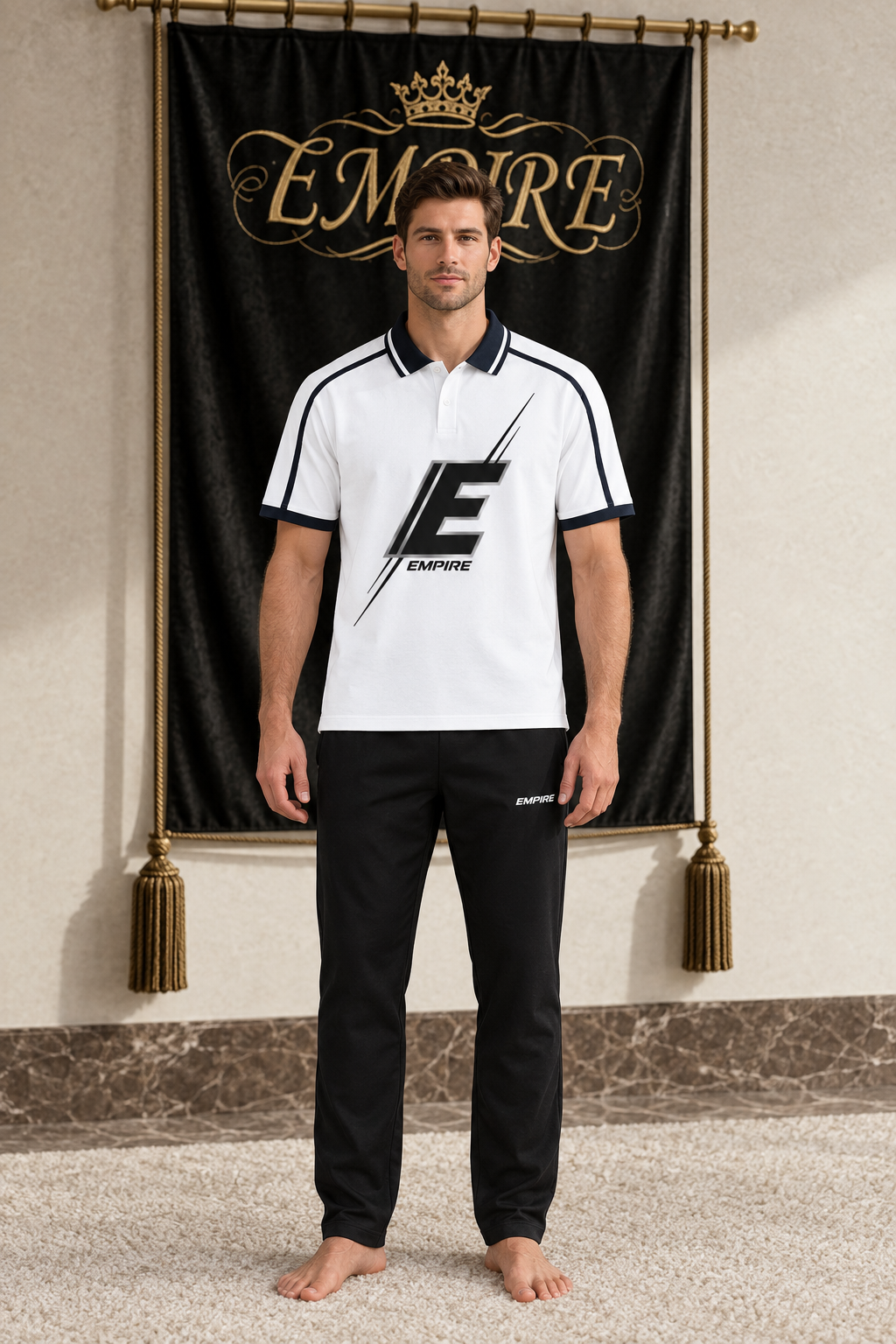 White men's EMPIRE contrast-piping raglan polo with large black E graphic, front view on barefoot male model