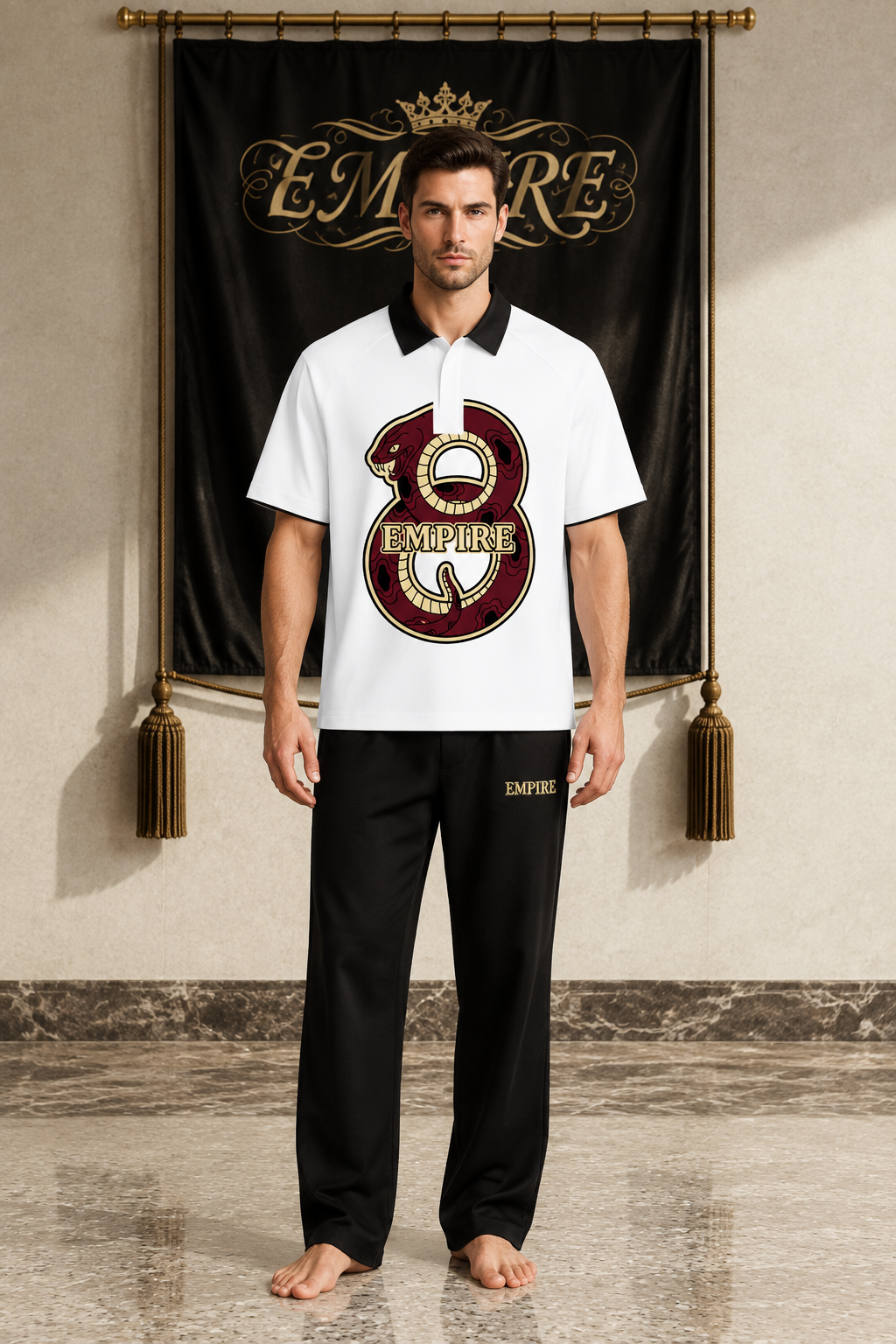 White men's EMPIRE raglan polo shirt with black contrast collar and burgundy-and-gold figure-eight snake graphic, front view on barefoot male model