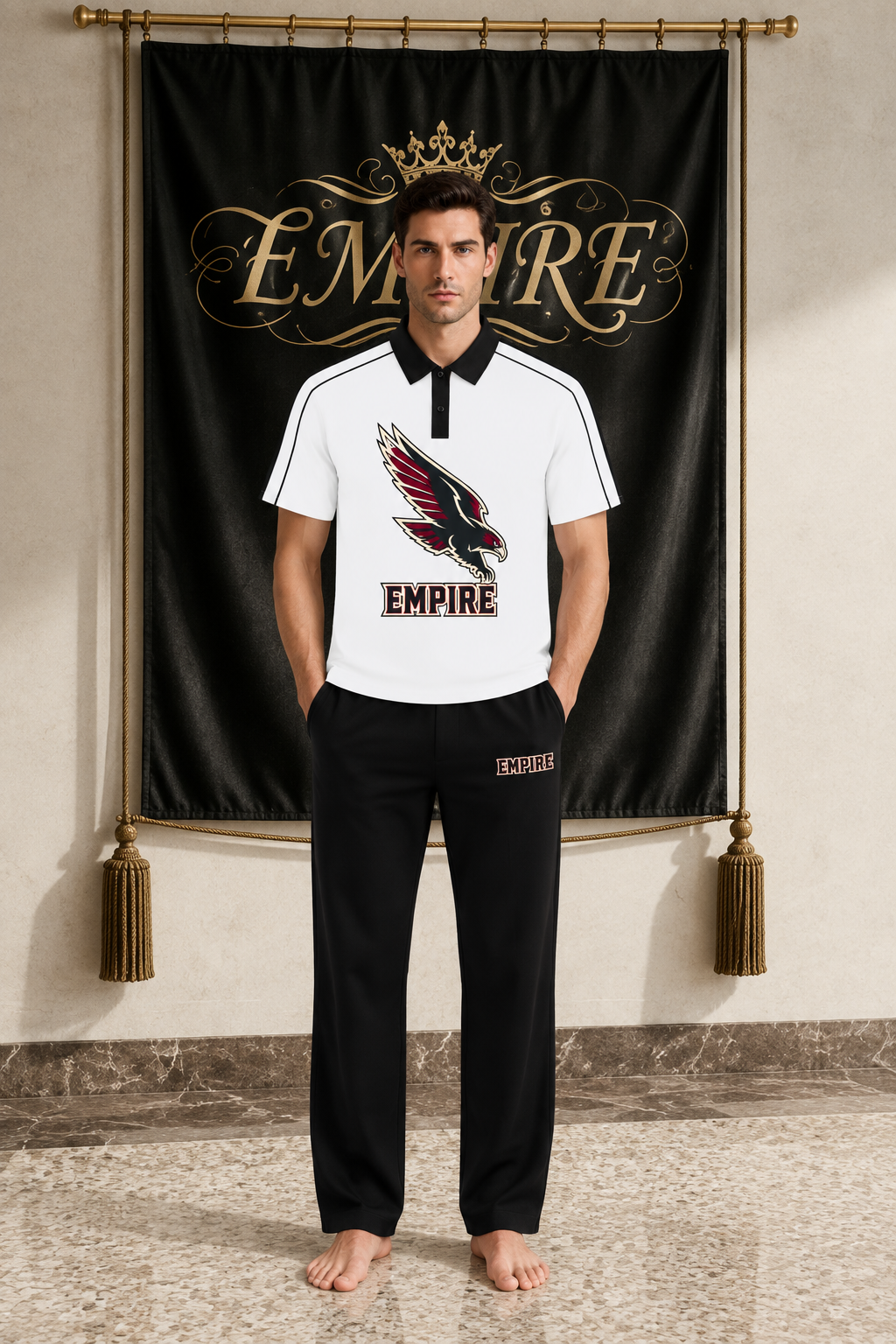 White men's EMPIRE contrast-collar polo shirt with black and burgundy diving falcon chest graphic, front view on barefoot male model