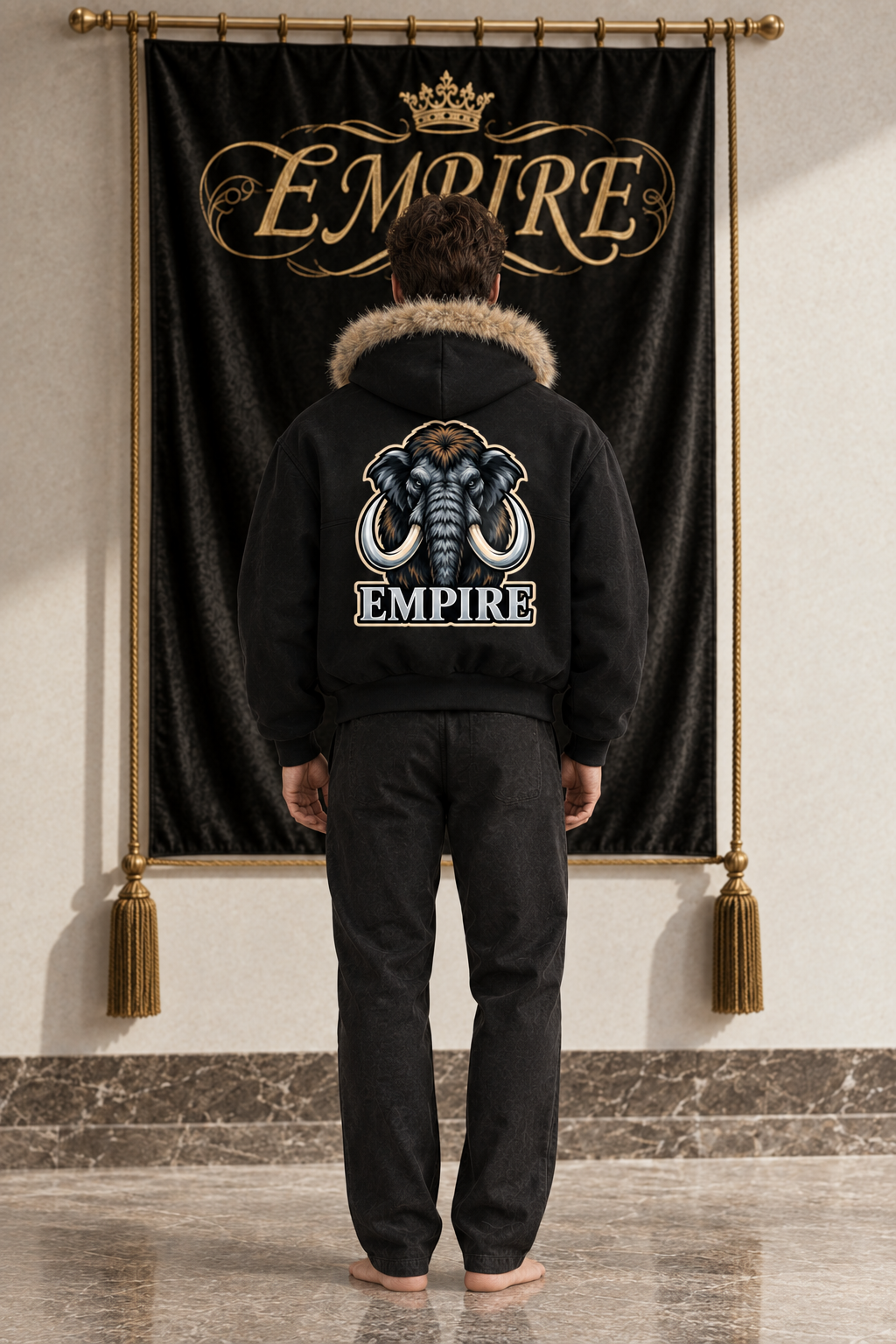 Black men's EMPIRE Ice Mammoth boxy hoodie with beige detachable fur trim and large mammoth graphic with ivory tusks, back view