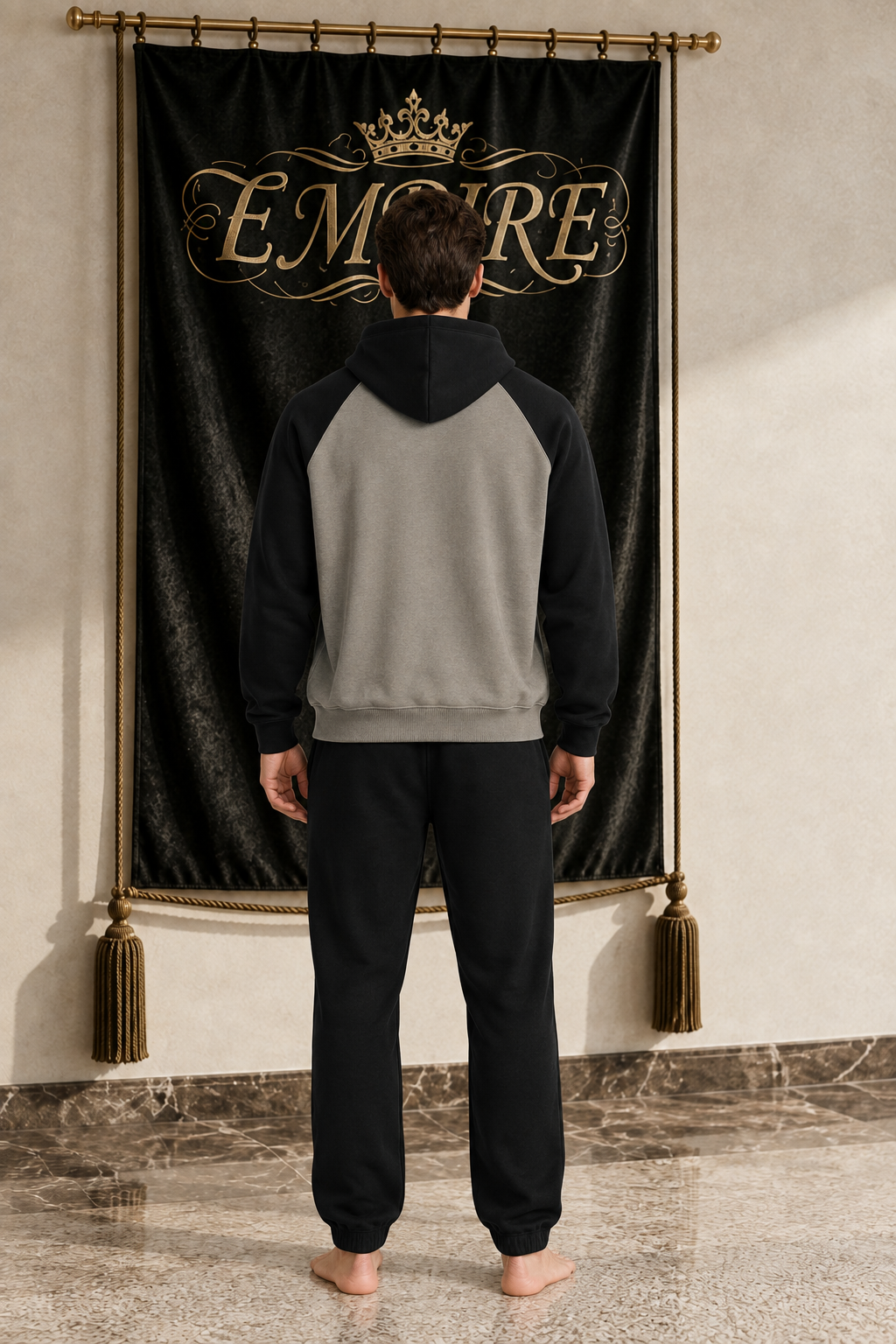 Taupe and black men's EMPIRE color-block raglan hoodie with plain back, rear view on barefoot male model