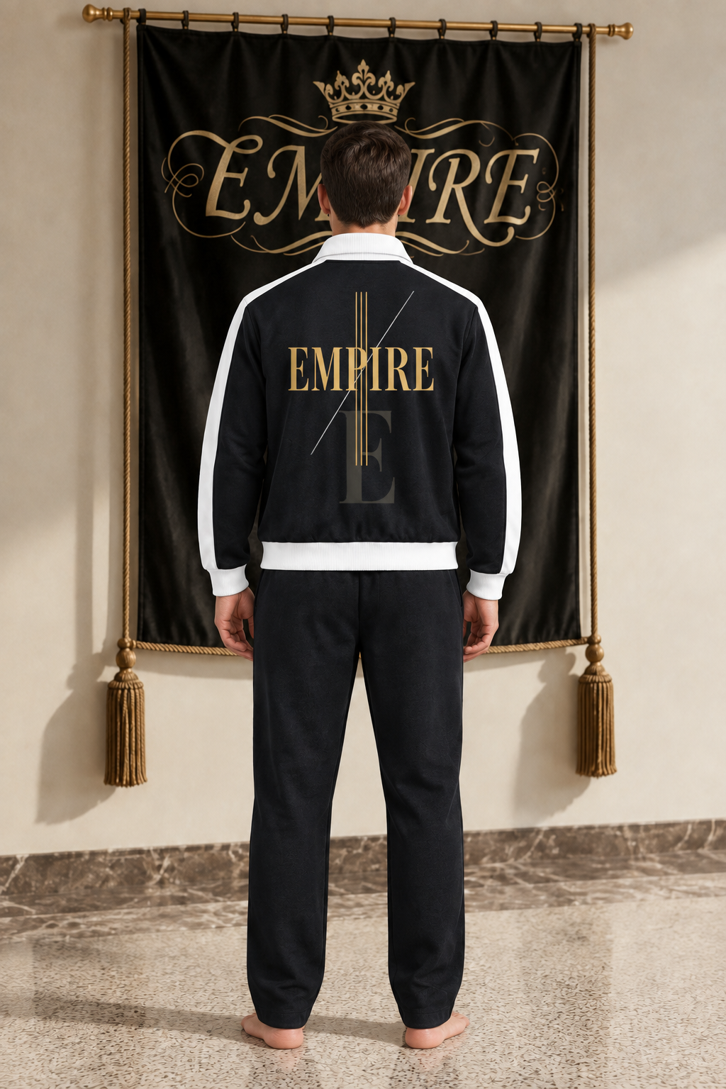 Black men's EMPIRE contrast-trim stand-collar jacket with gold wordmark and structural lines, back view on barefoot male model